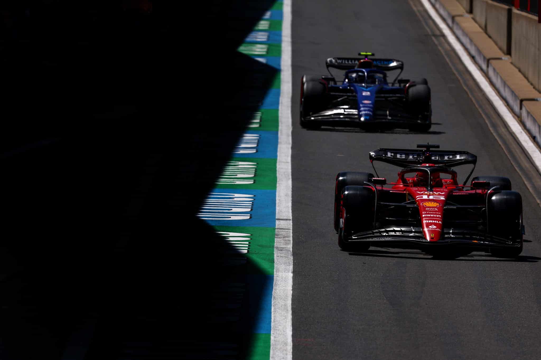 Charles Leclerc and Logan Sargeant in the pitlane during free practice at Silverstone