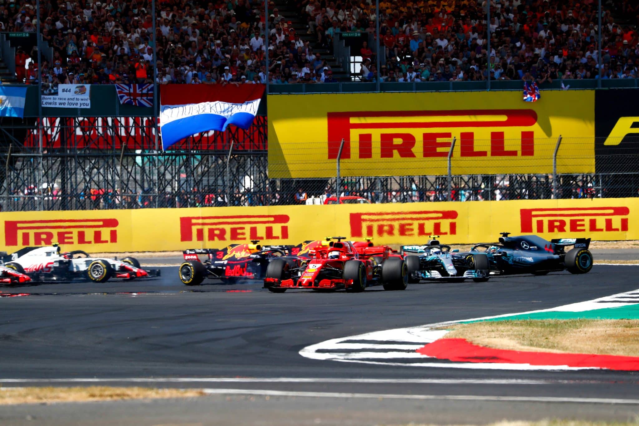 Most Memorable British GPs In F1 History - Revisiting four great races at Silverstone 4 Sebastian Vettel leads from Valtteri Bottas at Silverstone, as Lewis Hamilton is spun in the background